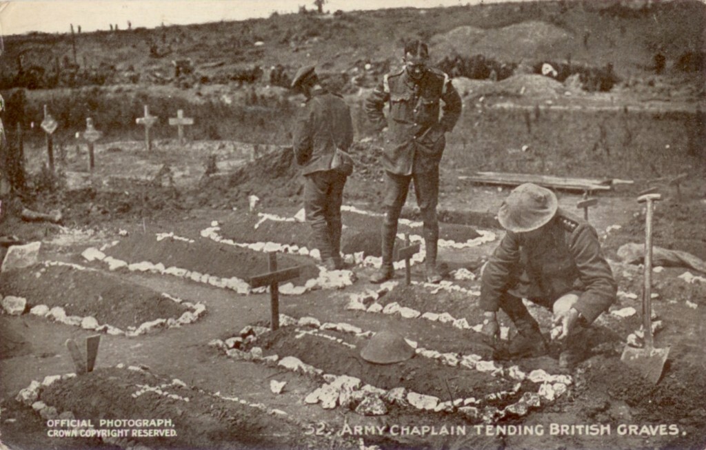 Army Chaplain tending British graves, from a Daily Mail Official War Photograph, reproduced via Wikimedia Commons.